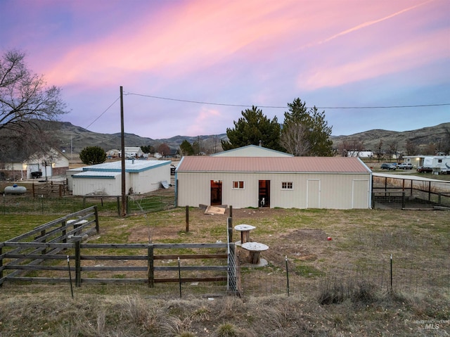 exterior space featuring an outbuilding and a mountain view