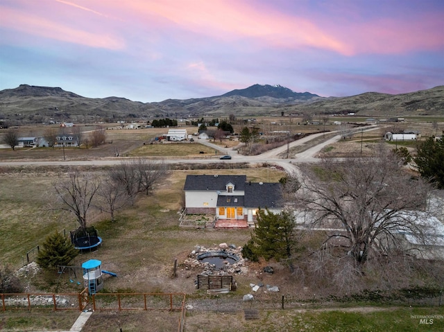 birds eye view of property featuring a rural view and a mountain view