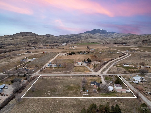 bird's eye view with a mountain view and a rural view