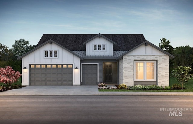 11801 W Reining Horse Ln, Kuna, ID 83634 - view of front of home featuring a standing seam roof, board and batten siding, concrete driveway, and brick siding