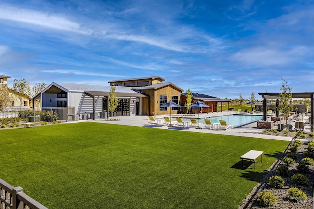 11801 W Reining Horse Ln, Kuna, ID 83634 - rear view of property with a community pool, a patio, and metal roof