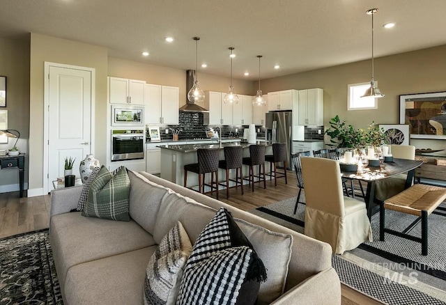 11801 W Reining Horse Ln, Kuna, ID 83634 - living room with dark wood-style flooring, recessed lighting, and baseboards
