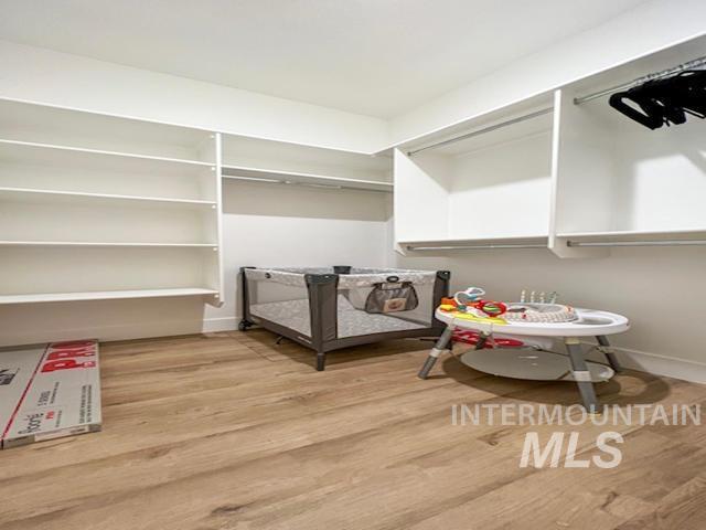 spacious closet featuring wood finished floors