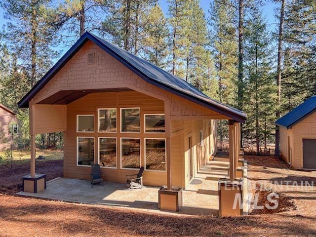 back of property with a patio area