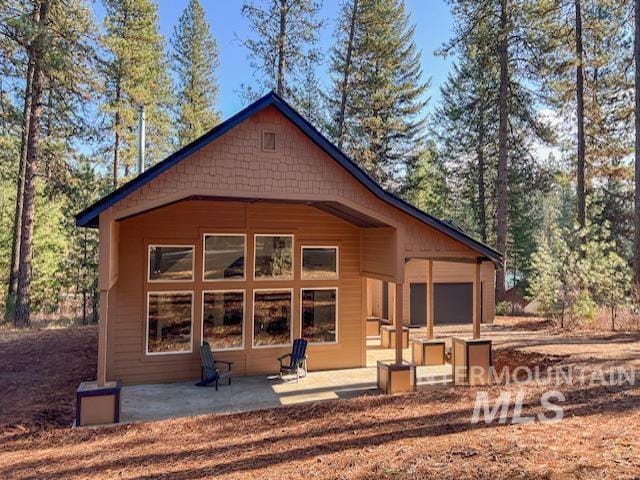 rear view of house with a patio area