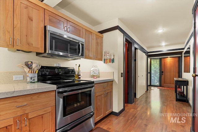 101 Minot St, Middleton, ID 83644 - kitchen with stainless steel appliances, light countertops, and light wood-style floors