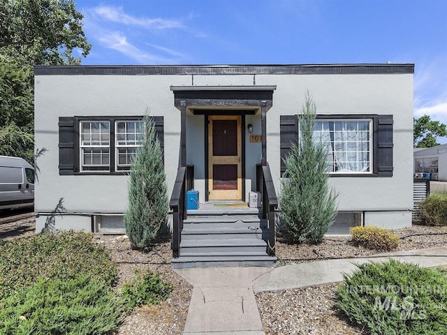 view of front of house featuring stucco siding