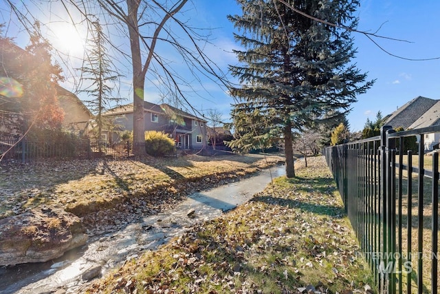 view of yard featuring fence