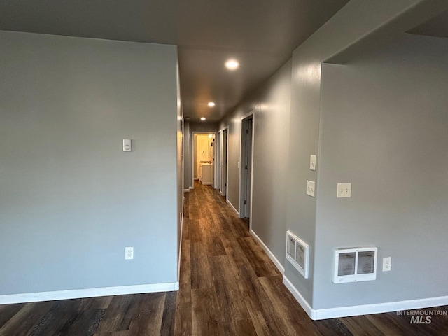 hall with dark hardwood / wood-style floors