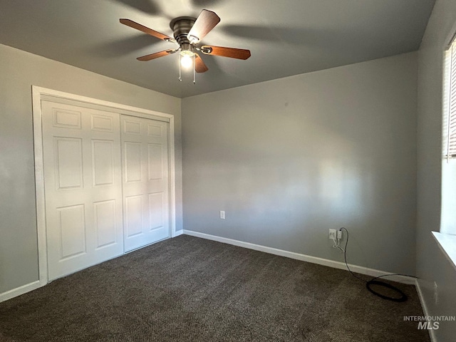 unfurnished bedroom featuring carpet floors, ceiling fan, and a closet