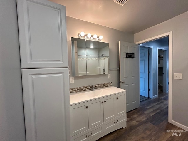 bathroom featuring vanity and wood-type flooring