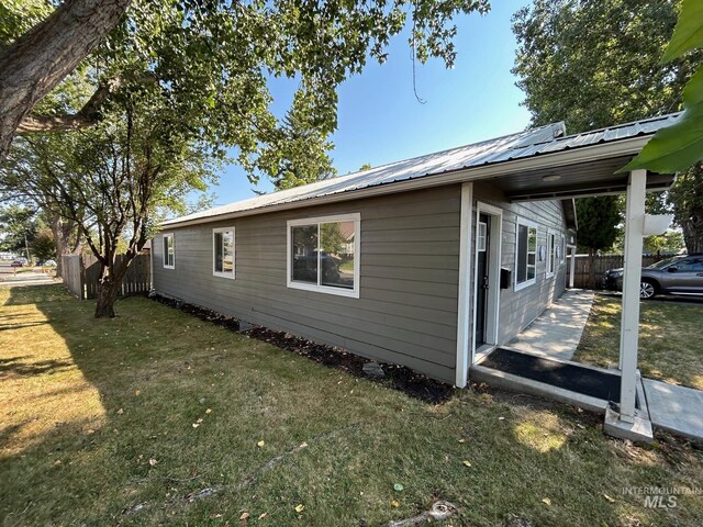 view of home's exterior featuring a lawn