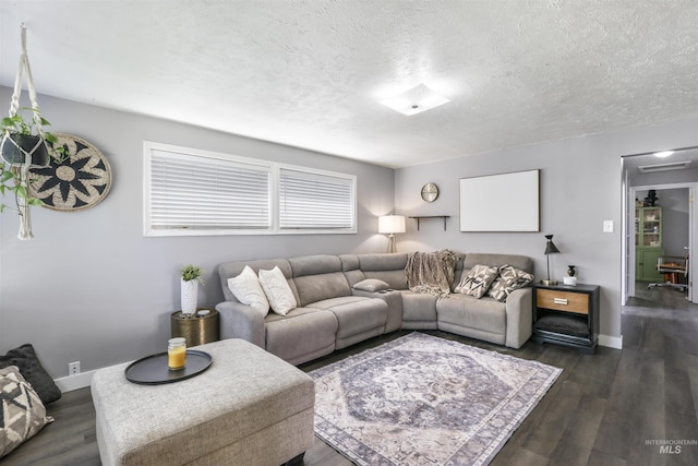 168 W Heyburn Ave, Twin Falls, ID 83301 - living room featuring dark wood-style flooring and a textured ceiling