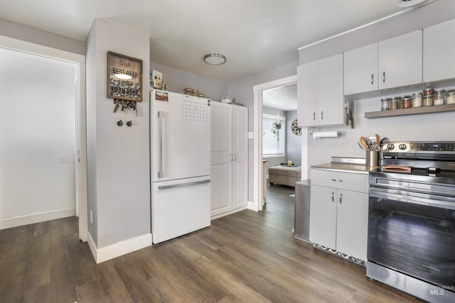 168 W Heyburn Ave, Twin Falls, ID 83301 - kitchen with freestanding refrigerator, stainless steel electric stove, dark wood finished floors, white cabinetry, and open shelves