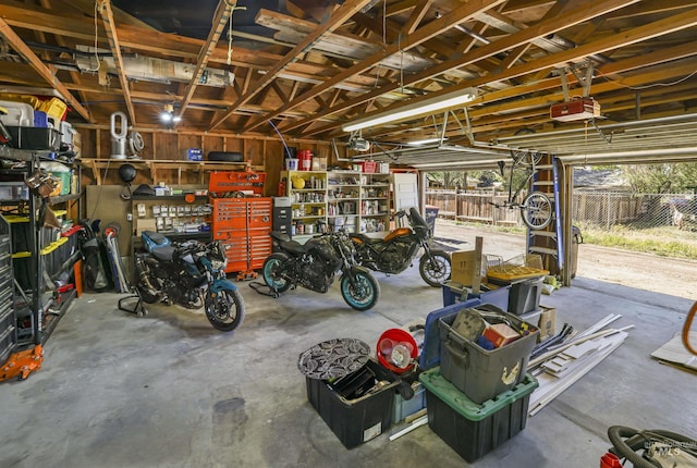 168 W Heyburn Ave, Twin Falls, ID 83301 - garage featuring a garage door opener and a workshop area