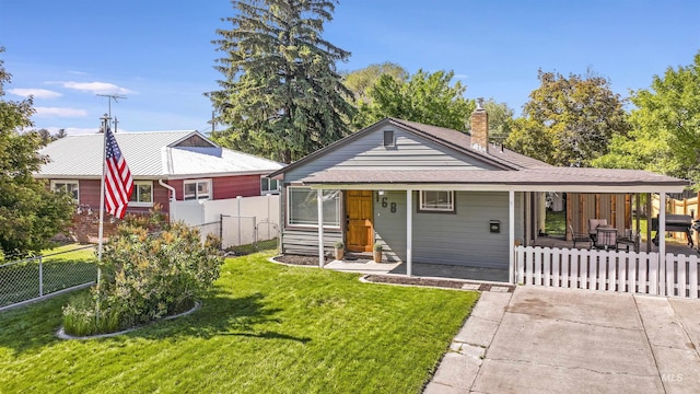 168 W Heyburn Ave, Twin Falls, ID 83301 - view of front of home with a chimney, a porch, and driveway