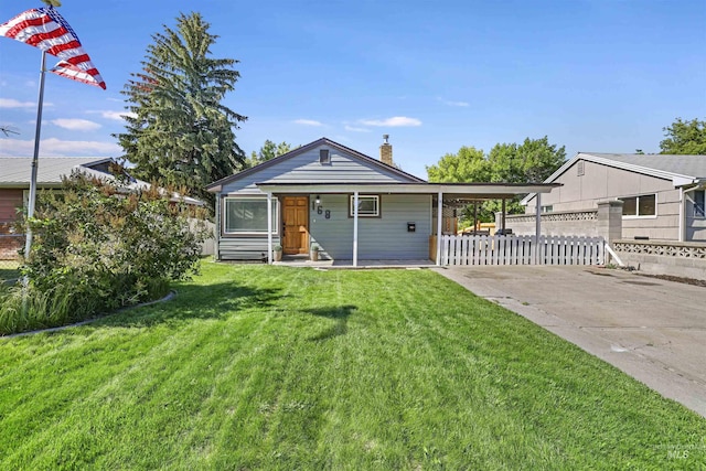 168 W Heyburn Ave, Twin Falls, ID 83301 - view of front of home with concrete driveway and a chimney