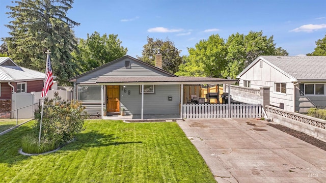 168 W Heyburn Ave, Twin Falls, ID 83301 - view of front facade featuring a chimney and driveway