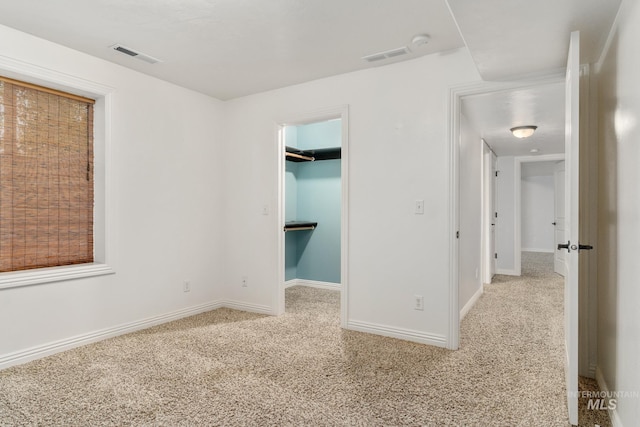 200 W Commons Rd, Idaho Falls, ID 83401 - unfurnished bedroom featuring carpet floors, a spacious closet, and a closet