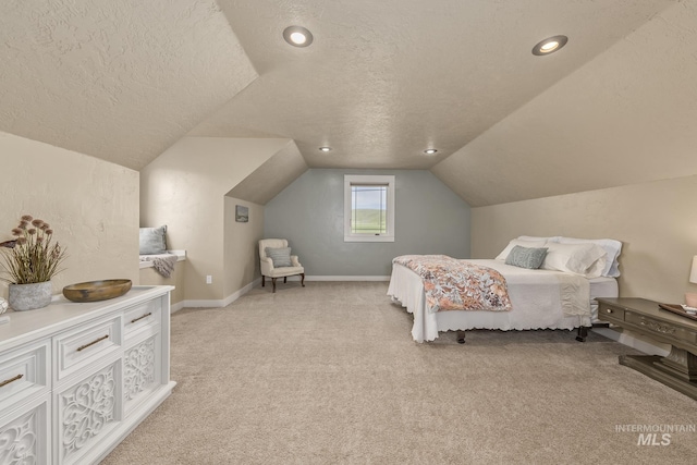 bedroom with a textured ceiling, light carpet, vaulted ceiling, baseboards, and recessed lighting