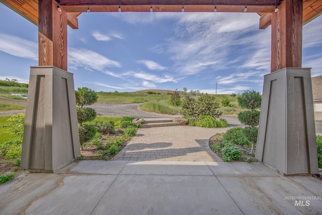 view of home's community featuring a patio area