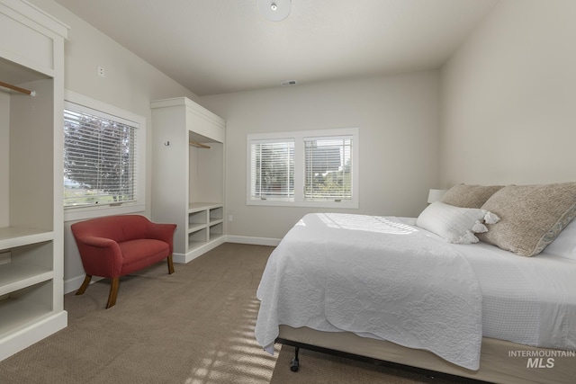carpeted bedroom with baseboards