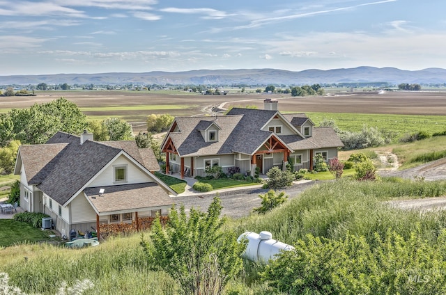 view of subject property featuring a mountain backdrop
