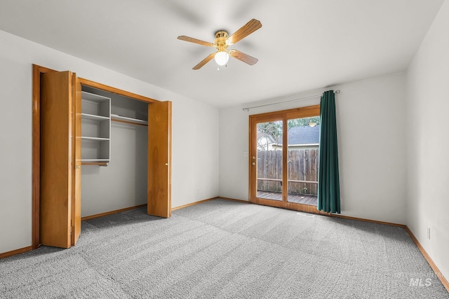 unfurnished bedroom featuring a ceiling fan, access to outside, a closet, carpet, and baseboards