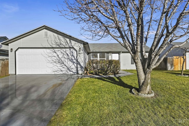 ranch-style house featuring a front yard and a garage