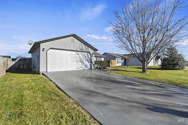 ranch-style home with a garage and a front yard