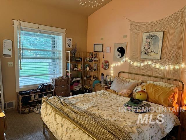 76 Rogers Ln, Mccall, ID 83638 - bedroom featuring carpet flooring and high vaulted ceiling