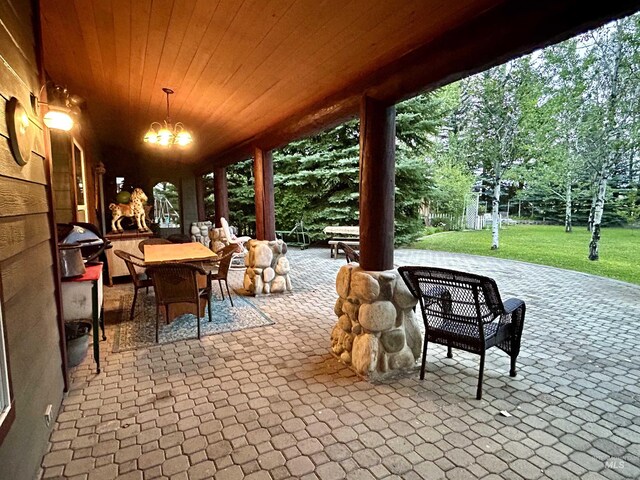 76 Rogers Ln, Mccall, ID 83638 - view of patio / terrace featuring outdoor dining area, area for grilling, and view of wooded area