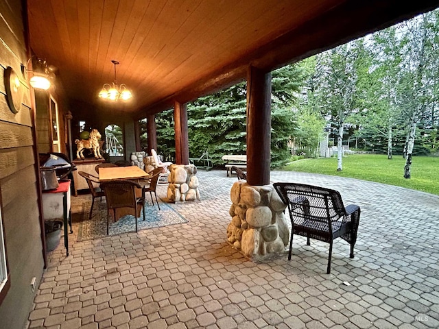 76 Rogers Ln, Mccall, ID 83638 - view of patio / terrace featuring outdoor dining area, area for grilling, and view of wooded area