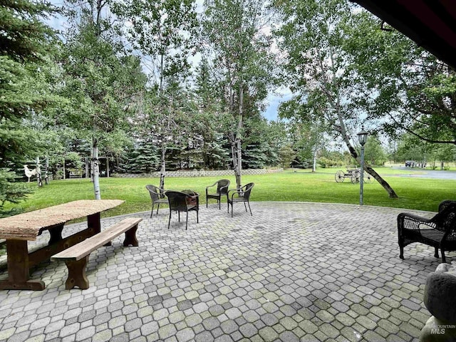 76 Rogers Ln, Mccall, ID 83638 - view of patio / terrace featuring view of scattered trees and an outdoor fire pit
