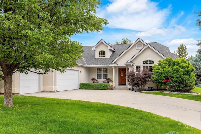 4335 W Quail Ridge Dr, Boise, ID 83703 - view of front of property featuring stucco siding, concrete driveway, a front lawn, and roof with shingles