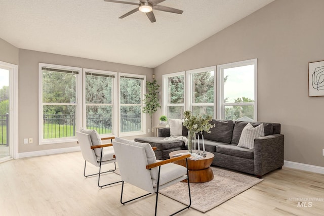 4335 W Quail Ridge Dr, Boise, ID 83703 - living room with light wood finished floors, a ceiling fan, vaulted ceiling, and a textured ceiling