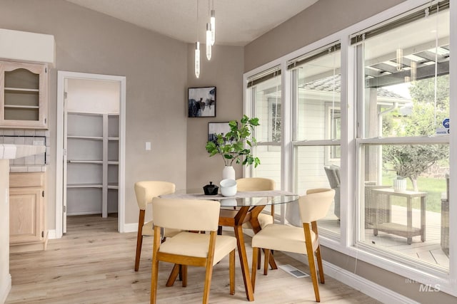 4335 W Quail Ridge Dr, Boise, ID 83703 - dining room with healthy amount of natural light and light wood-style flooring