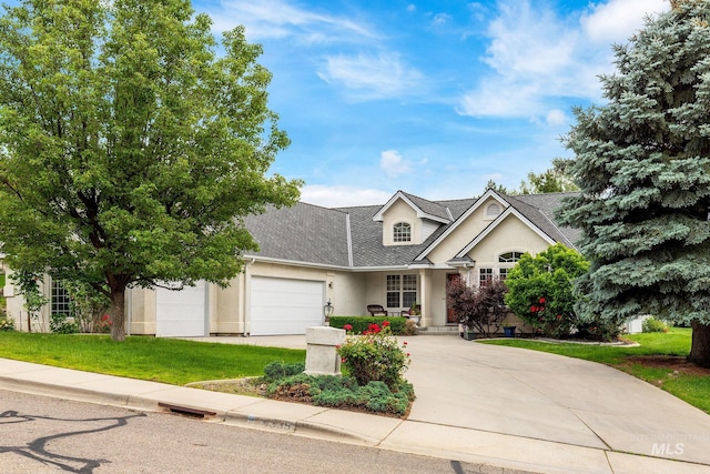4335 W Quail Ridge Dr, Boise, ID 83703 - traditional-style house with stucco siding, an attached garage, driveway, a shingled roof, and a front yard