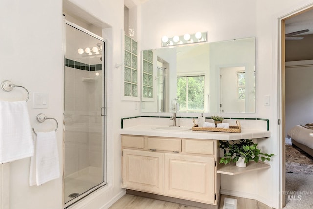 4335 W Quail Ridge Dr, Boise, ID 83703 - bathroom with ensuite bath, a stall shower, vanity, and wood finished floors