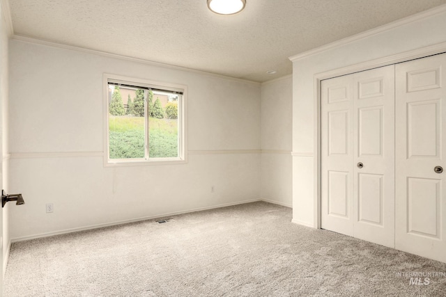 4335 W Quail Ridge Dr, Boise, ID 83703 - unfurnished bedroom with carpet flooring, crown molding, a textured ceiling, and a closet