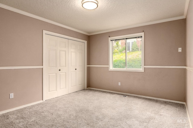 4335 W Quail Ridge Dr, Boise, ID 83703 - unfurnished bedroom with a textured ceiling, carpet flooring, a closet, and crown molding