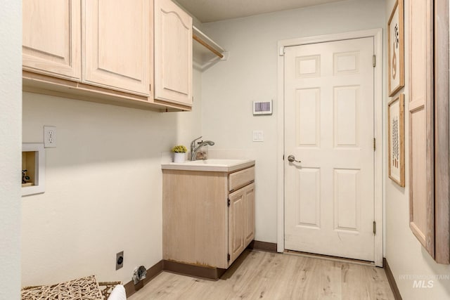 4335 W Quail Ridge Dr, Boise, ID 83703 - washroom with cabinet space, light wood-style floors, hookup for an electric dryer, and hookup for a washing machine
