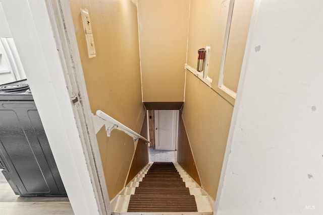 staircase with wood-type flooring