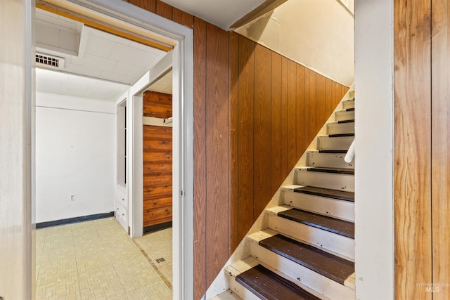 stairway with wooden walls