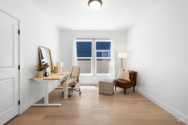 office with wood finished floors and baseboards