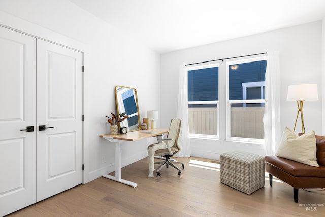 office with wood finished floors and baseboards