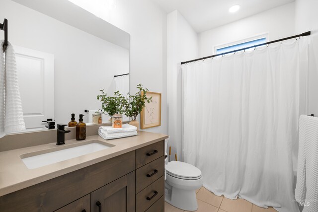 bathroom with tile patterned floors, toilet, vanity, curtained shower, and recessed lighting