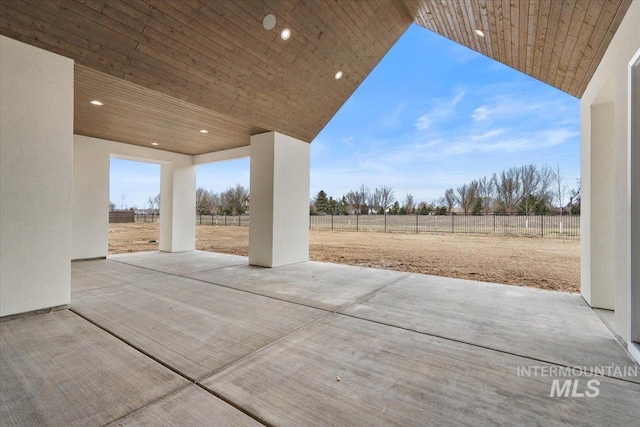 view of patio / terrace featuring fence