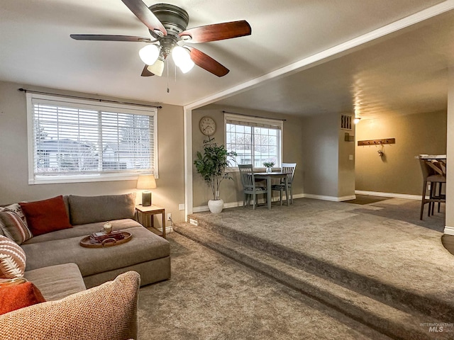 living room featuring carpet flooring and ceiling fan