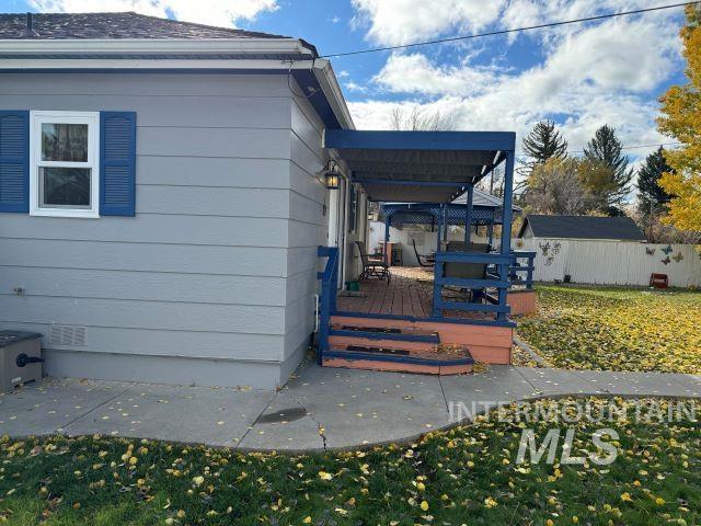 view of side of property with a deck